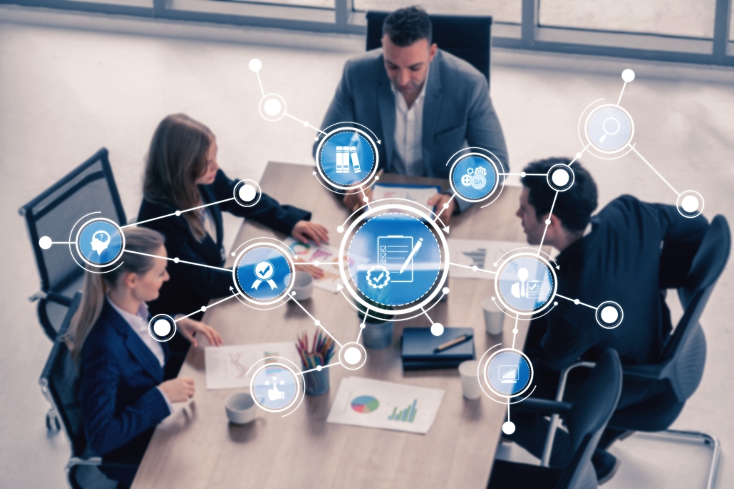 A,Group,Of,Professionals,Collaborates,At,A,Conference,Table,,Employing